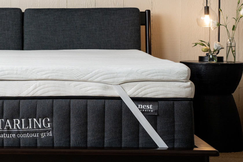 Cooling Topper corner strap wrapped around the Starling signature contour grid mattress, bedroom scene